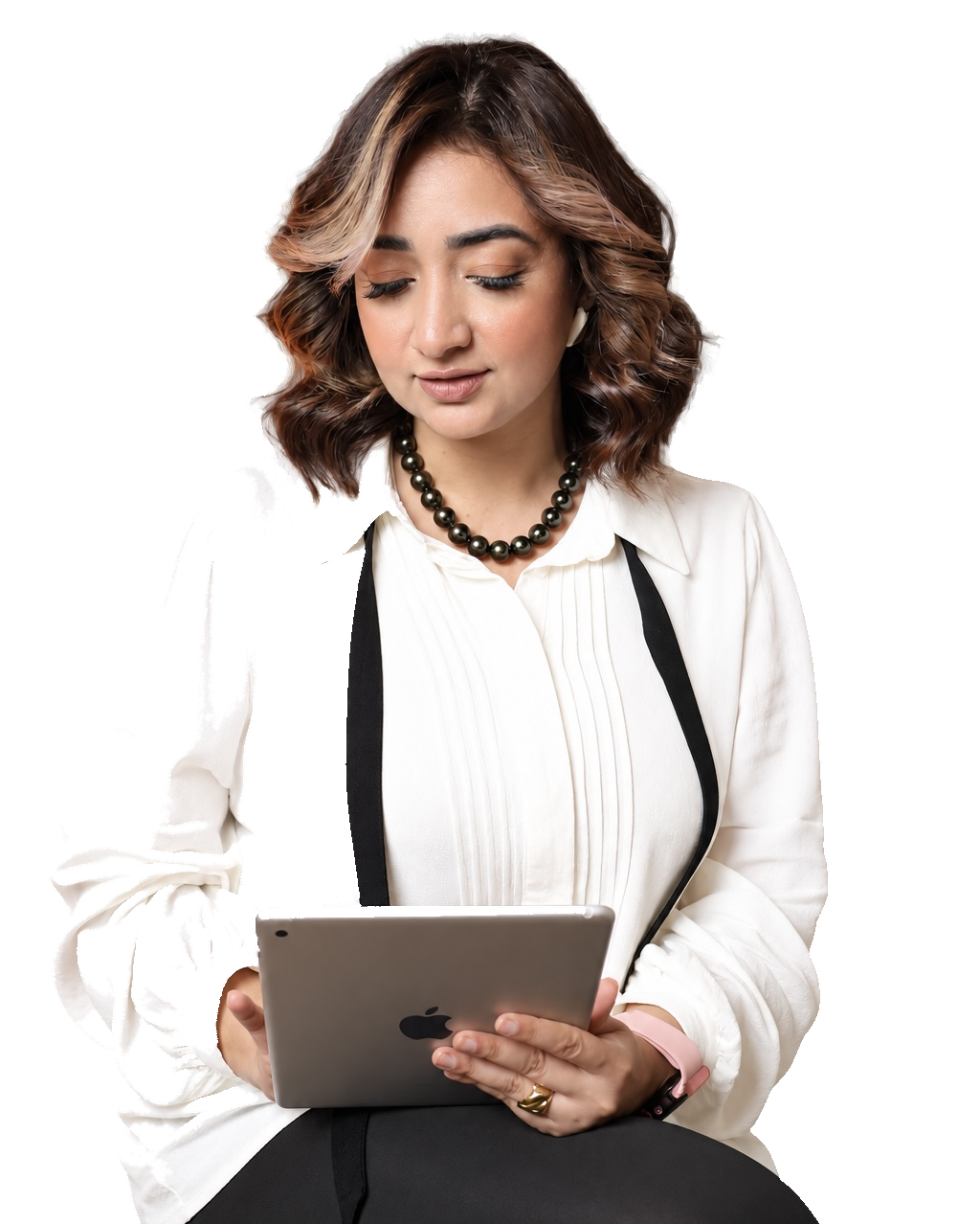 Mai Sami looking down at an iPad held in her hands