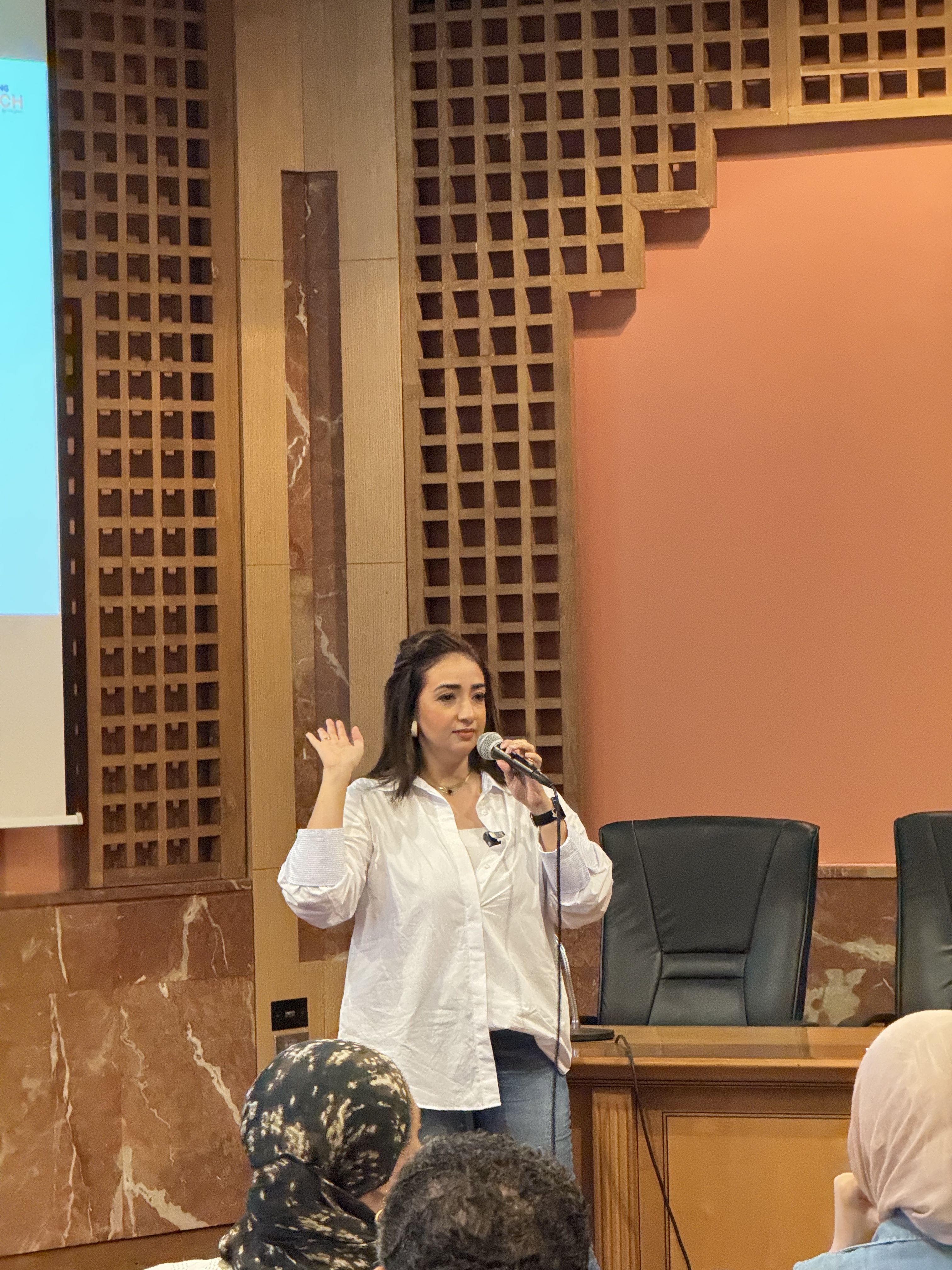 Closer photograph of Mai teaching in a white shirt at Techne Summit Alexandria 2024
